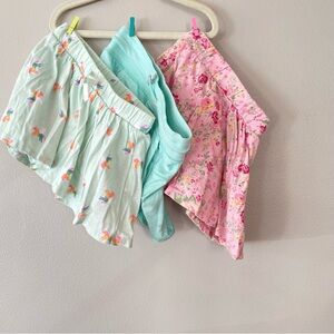 Bundle of 3 size 4 skirts with shorts, skorts, athletic shorts.
